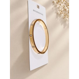 دستبند النگویی طلایی بیضی نگین دار برند accessories