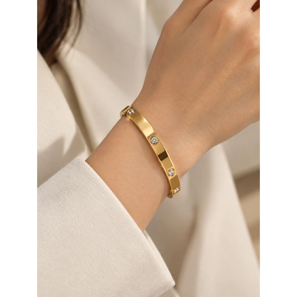 دستبند النگویی طلایی بیضی نگین دار برند accessories