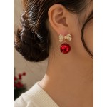 گوشواره پاپیونی نگین دار طلایی با آویز گوی قرمز برند accessories