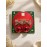 گوشواره پاپیونی نگین دار طلایی با آویز گوی قرمز برند accessories