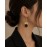 گوشواره میخی آویز طلایی و سنگ مشکی برند accessories